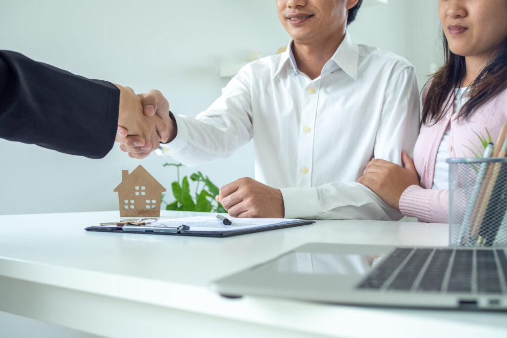 A handshake during a mortgage closing.