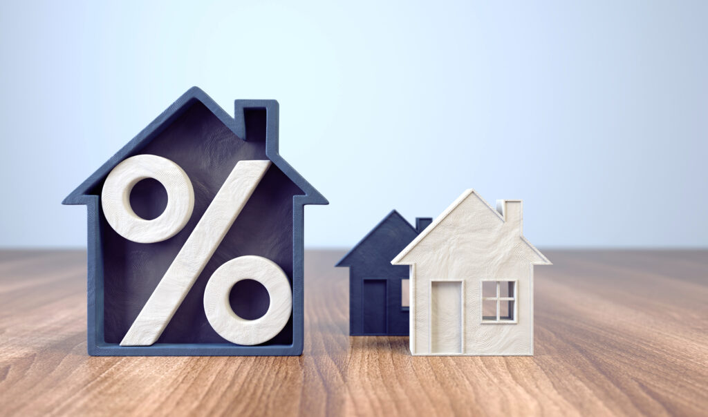 Mortgage Rates. A % Sign and a House Cut Out